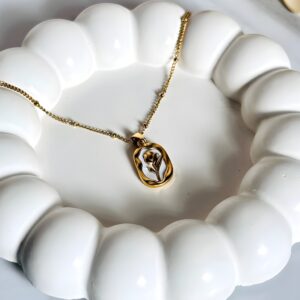 Elegant gold pendant with intricate design for women – perfect for weddings, parties, and gifting. Shop premium gold jewelry online.