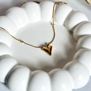 Elegant gold pendant with intricate design for women – perfect for weddings, parties, and gifting. Shop premium gold jewelry online.